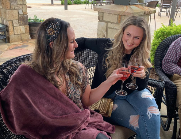 molly enjoying wine with friends